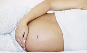 Почему на 12 неделе беременности болит низ живота