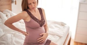 18 недель беременности болит спина