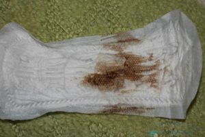 Коричневые выделения за две недели до месячных